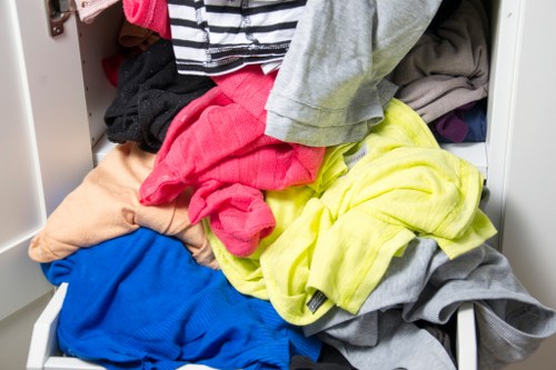 Volunteers sorting donated furniture for reuse