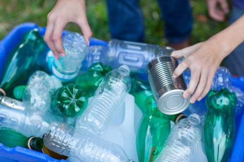 Business staff separating cardboard and recyclables on-site